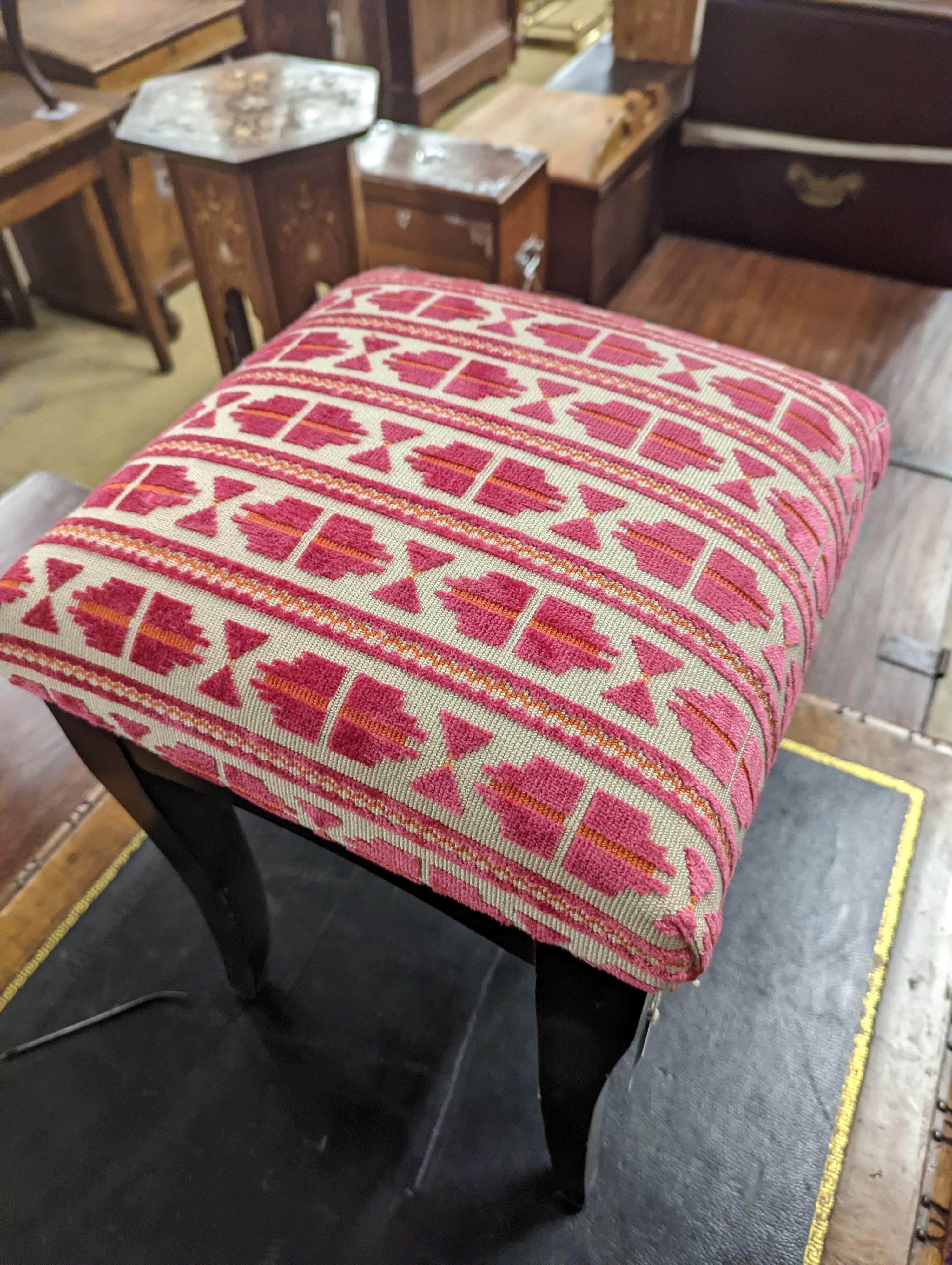 A square ebonised footstool upholstered in Andrew Martin fabric, width 32cm, height 50cm